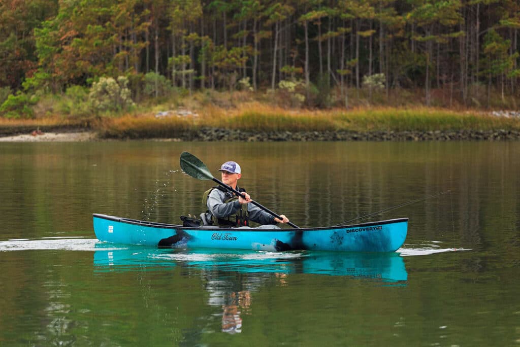 A person solo paddling in a kayak