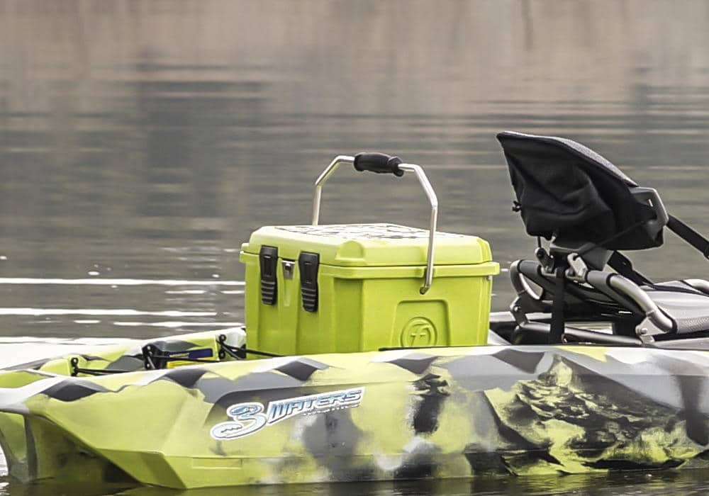 A view of a green cooler sitting on a kayak in sea