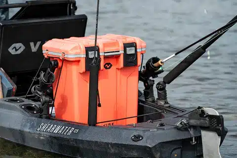 A view of an orange kayak cooler for fishing on a fishing kayak