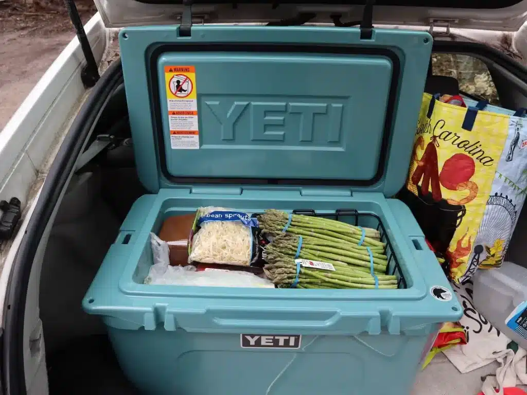 An open view of Yeti Tundra ice cooler with items in it