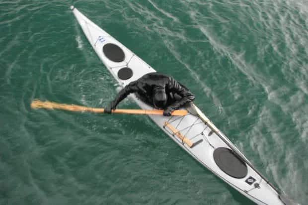 a kayaker doing storm roll