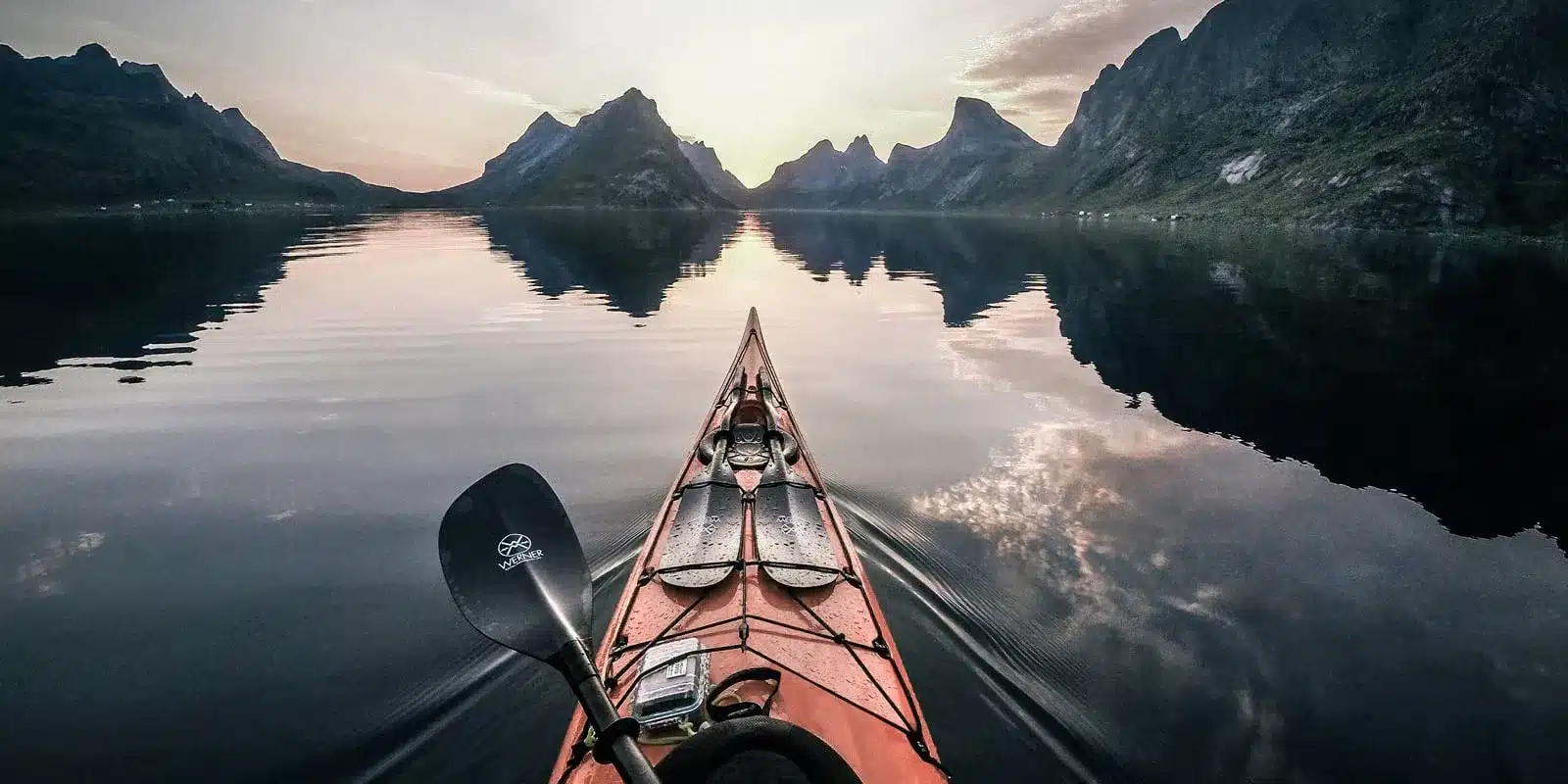 a front deck of kayak with a paddle on island water