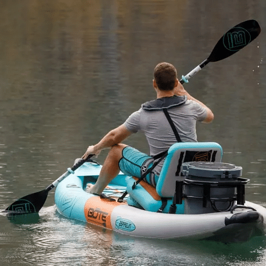 back view of a man kayaking in water