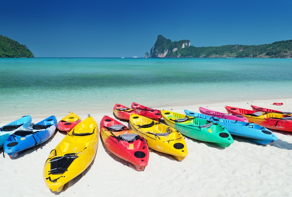 colorful kayaks on a beach