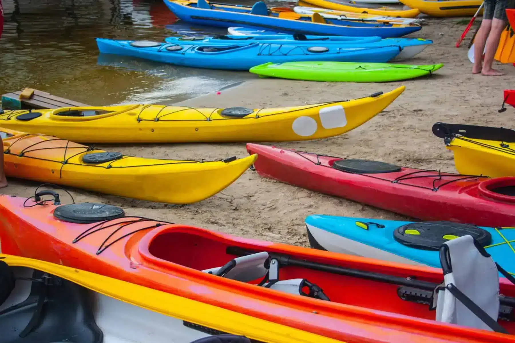 different ypes of coloful kayaks