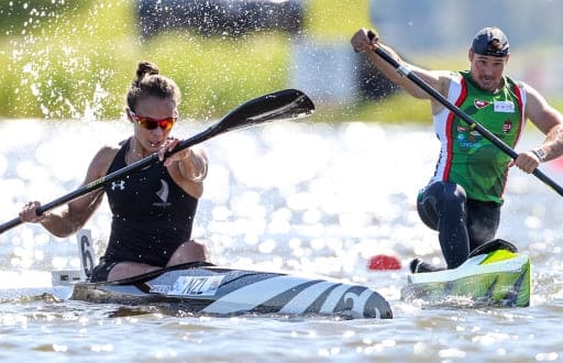 two water sports players on thei kayak and canoe