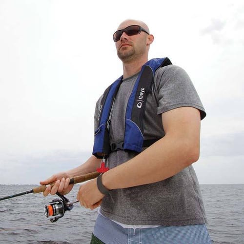 A kayaker wearing Onyx Inflatable Life Jacket