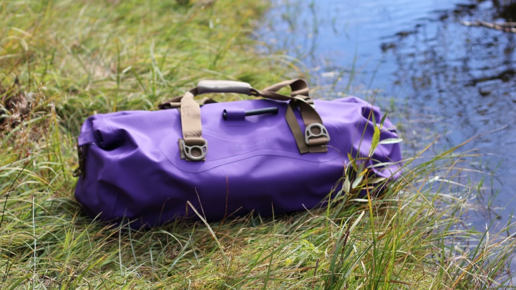 Watershed Ocoee Duffel Bag placed on the grass