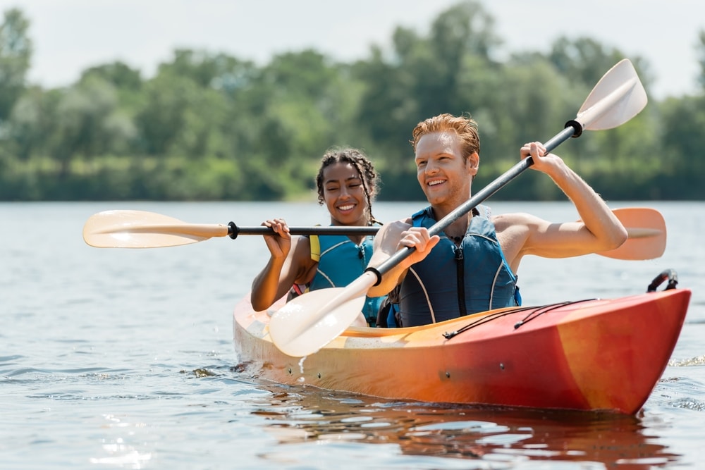 Active Redhead Man And Charming African American Woman In Life