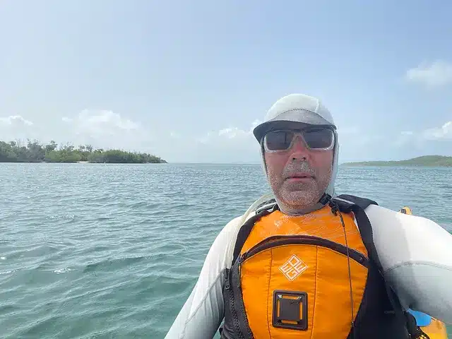 an old man wearing Stohlquist Edge Life Jacket