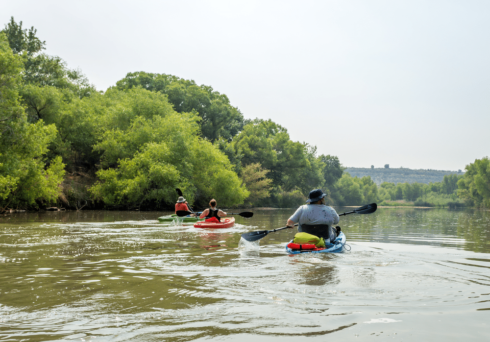 kayakers kayakig in Verde River Arizona