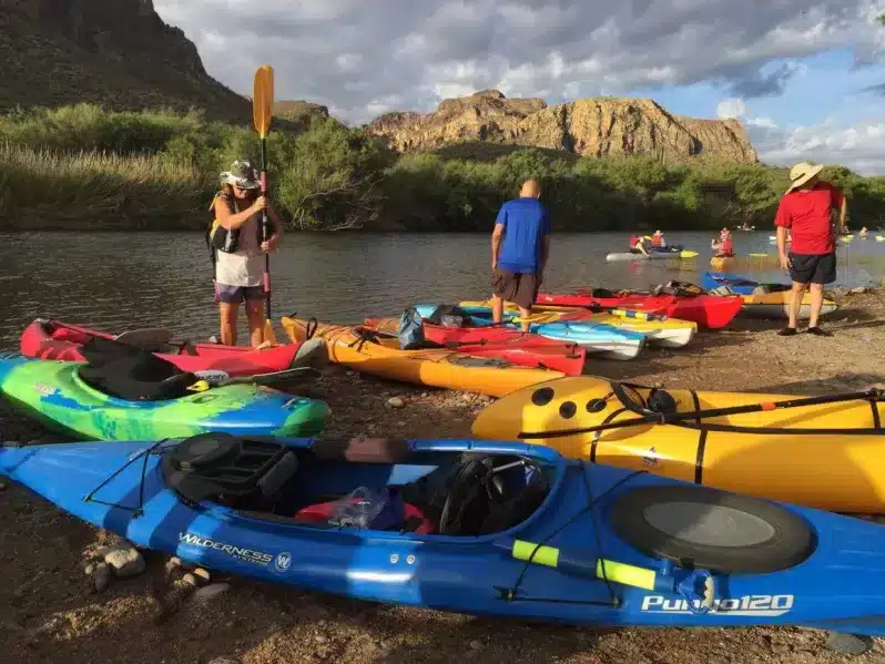 kayaks and kayakers preparing for kayaking in salt water