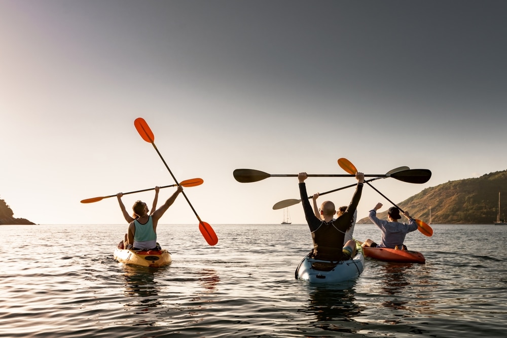 Group Of Young Happy Kayakers Are Having Fun In Winner